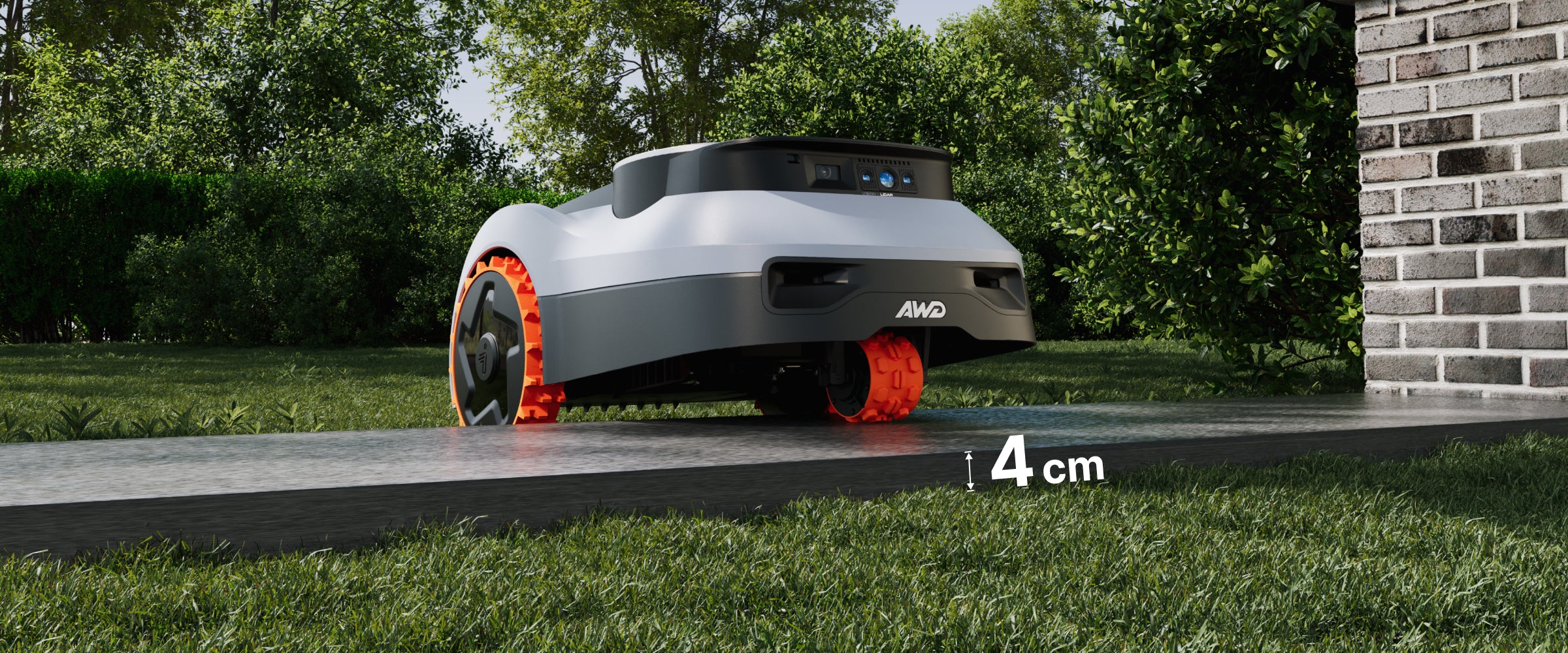 Navimow H AWD robot tondeuse franchit une bordure de pelouse.