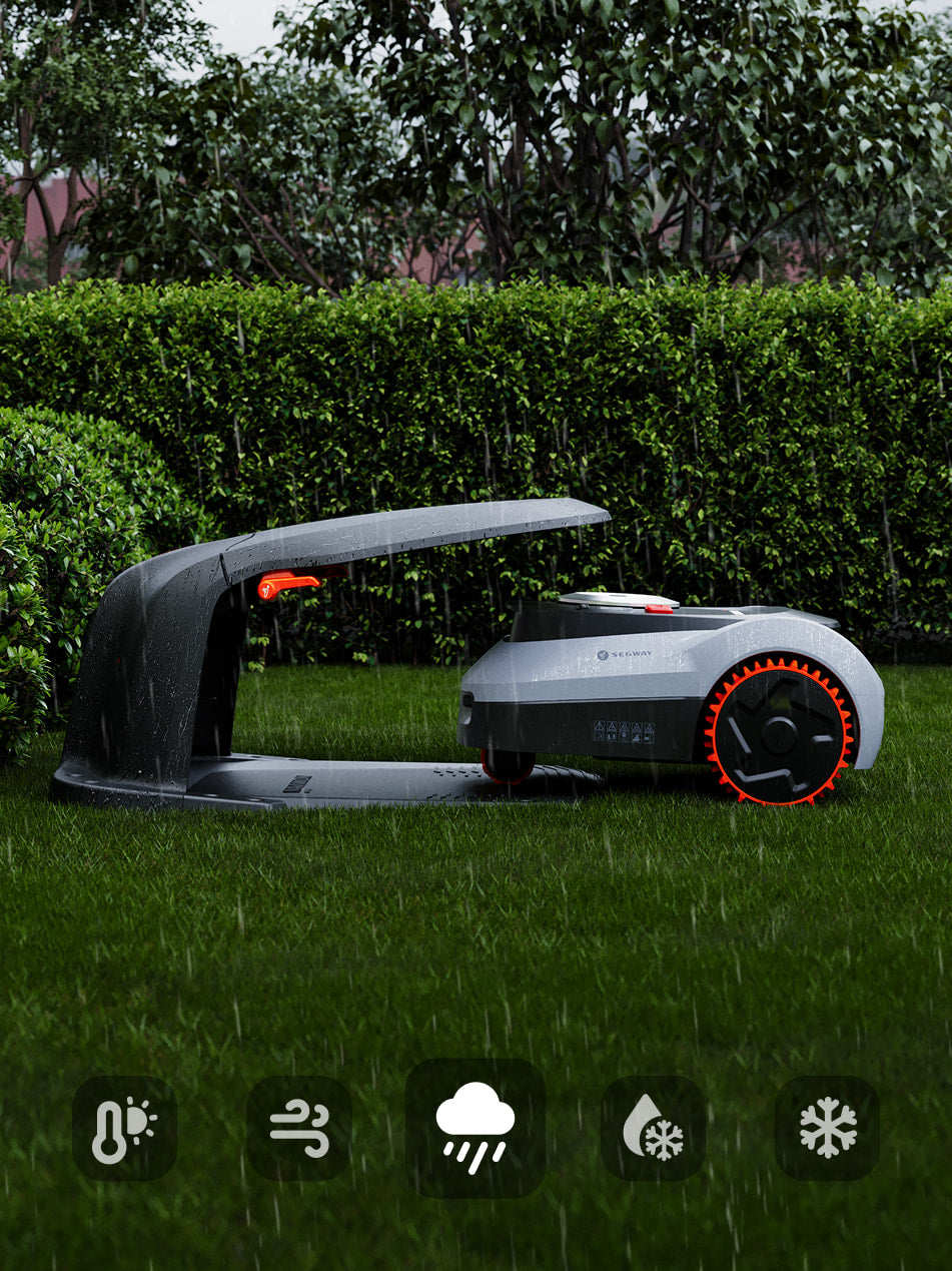 Segway Navimow tondeuse robot sous son abri pendant la pluie.