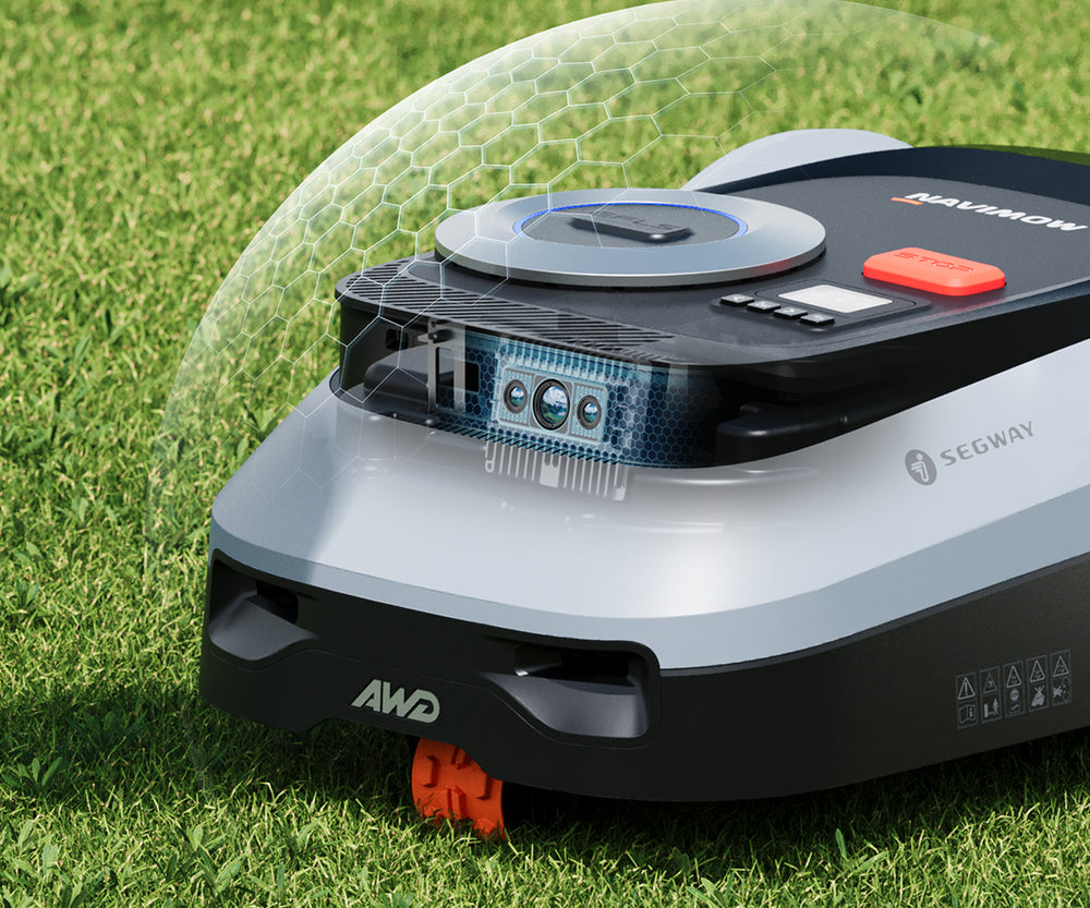 Segway Navimow robot tondeuse tondant une pelouse verte avec précision.